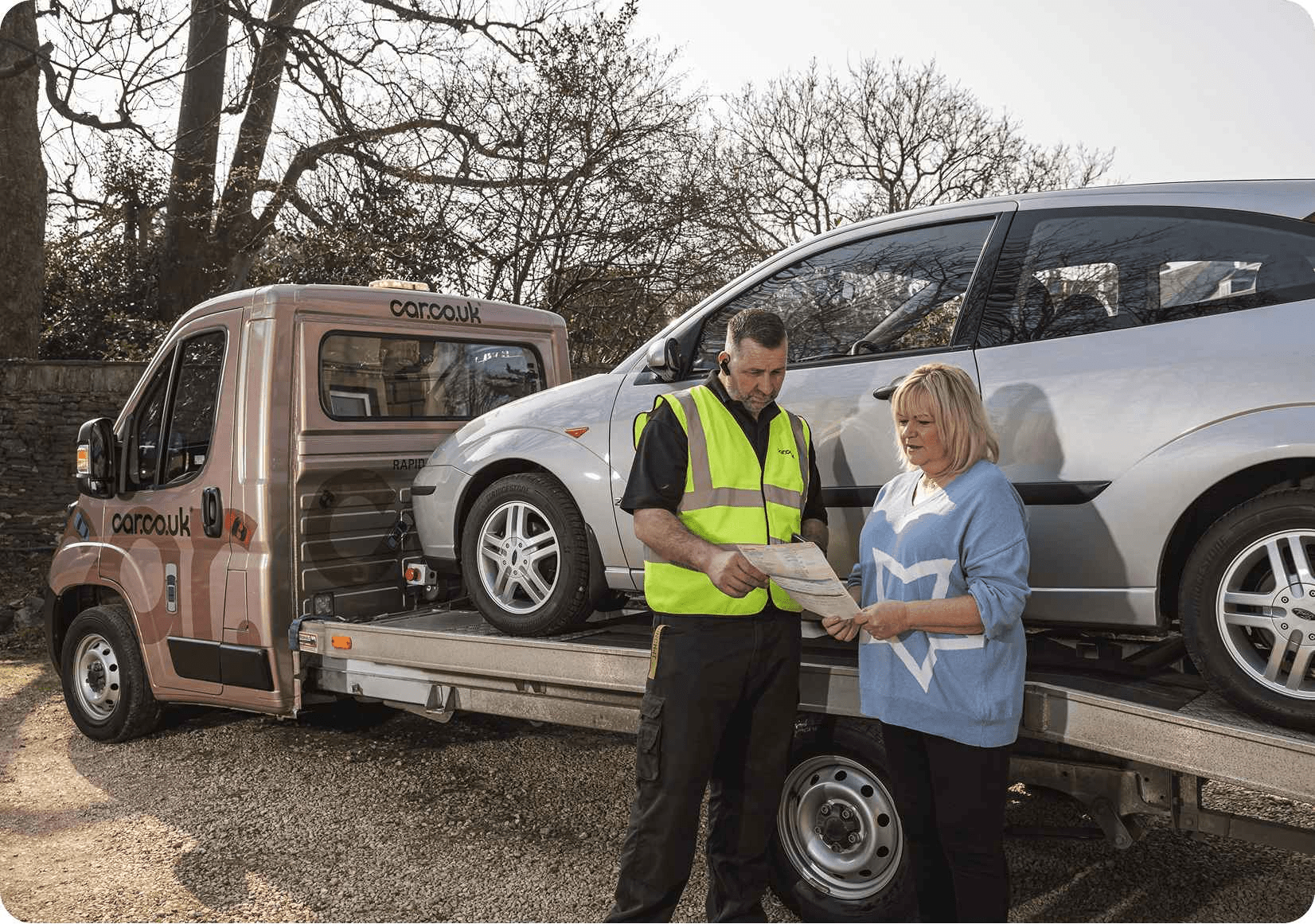Car recovery truck picking up car